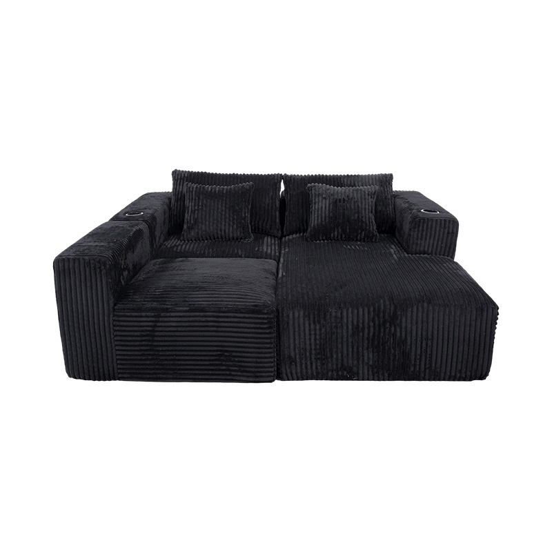 Großes L-förmiges Ecksofa aus schwarzem Cord mit Vollschaummodulen, mehreren Kissen und integrierten Getränkehaltern Großes L-förmiges Ecksofa aus schwarzem Cord mit Vollschaummodulen, mehreren Kissen und integrierten Getränkehaltern